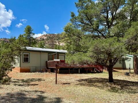 34 Halcon Rd, Ramah, NM 87321 - back of property featuring a deck with mountain view