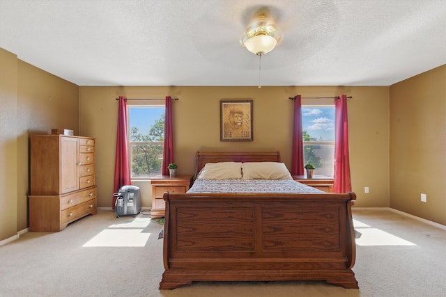 2115 Cortina Loop SE, Rio Rancho, NM 87124 - bedroom with light carpet, baseboards, and a textured ceiling
