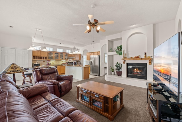 1908 Selway Pl NW, Albuquerque, NM 87120 - living area featuring ceiling fan, carpet flooring, a textured ceiling, and a glass covered fireplace