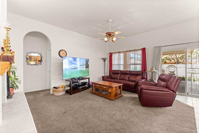 1908 Selway Pl NW, Albuquerque, NM 87120 - living room with arched walkways, ceiling fan, carpet, and a textured ceiling