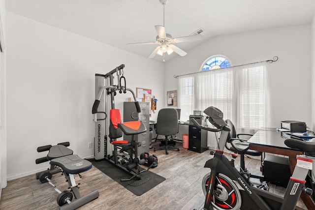 1908 Selway Pl NW, Albuquerque, NM 87120 - workout area featuring wood finished floors, ceiling fan, and vaulted ceiling