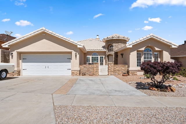 1908 Selway Pl NW, Albuquerque, NM 87120 - mediterranean / spanish home with stucco siding, driveway, stone siding, and an attached garage