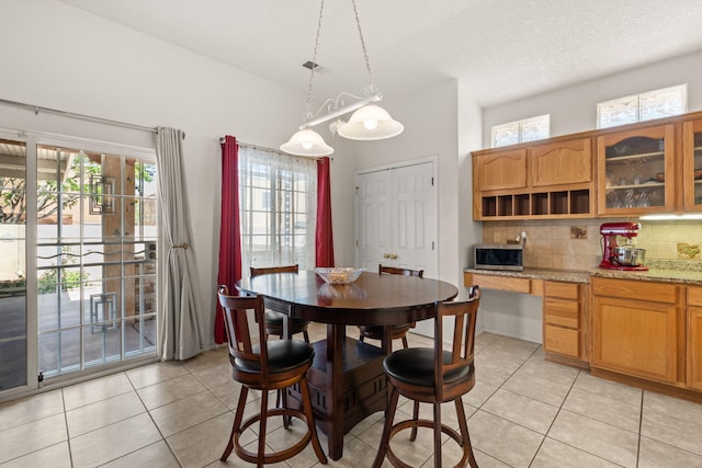 1908 Selway Pl NW, Albuquerque, NM 87120 - dining room with light tile patterned floors and plenty of natural light