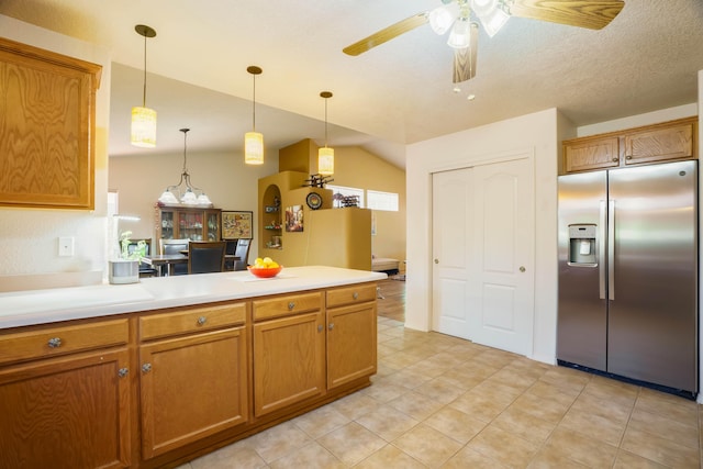6105 Loro Ave NW, Albuquerque, NM 87114 - kitchen featuring stainless steel fridge, brown cabinetry, a peninsula, ceiling fan, and lofted ceiling