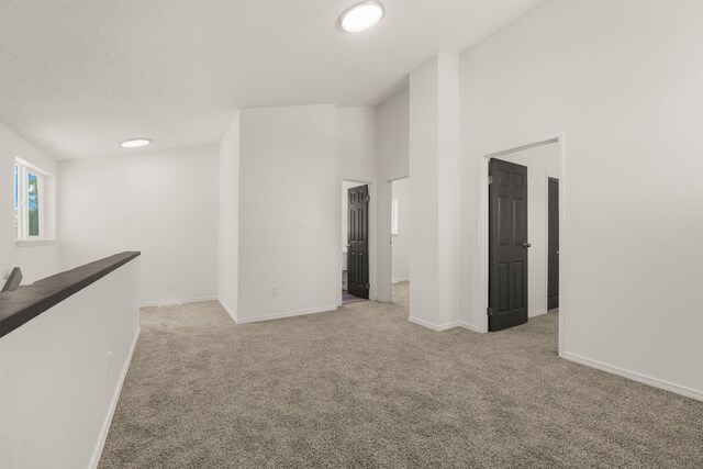 1616 Vail Pl SE, Albuquerque, NM 87106 - unfurnished room featuring light carpet and baseboards