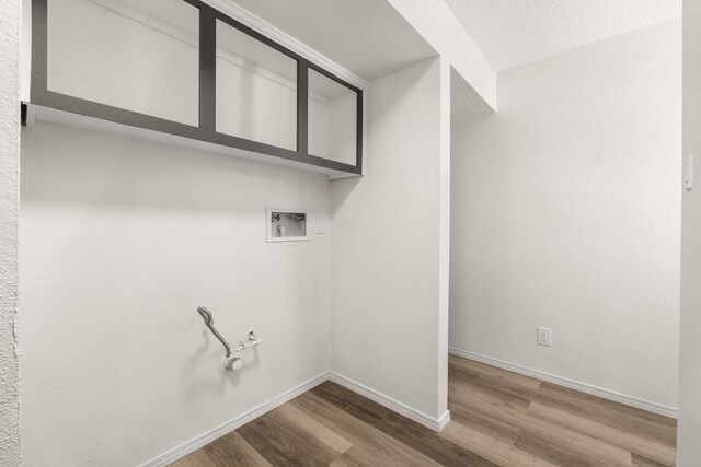 1616 Vail Pl SE, Albuquerque, NM 87106 - laundry room with washer hookup, wood finished floors, baseboards, and hookup for a gas dryer