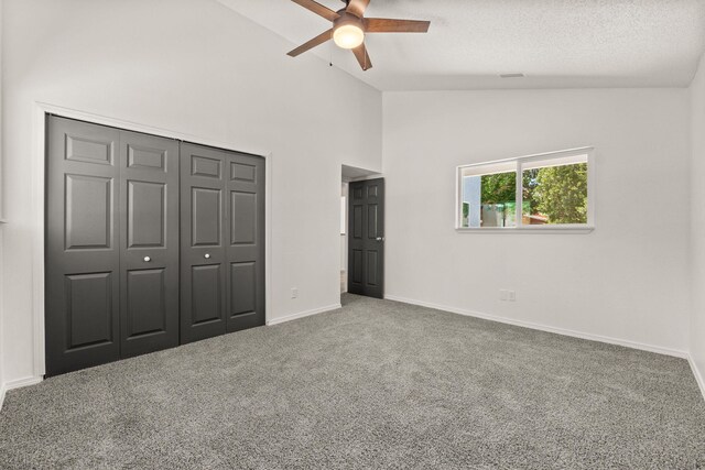 1616 Vail Pl SE, Albuquerque, NM 87106 - unfurnished bedroom featuring carpet floors, baseboards, a closet, high vaulted ceiling, and a textured ceiling