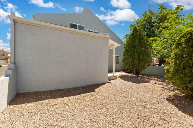 1616 Vail Pl SE, Albuquerque, NM 87106 - view of side of property with stucco siding