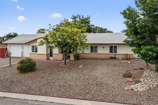 2110 Twisted Juniper Rd SE, Rio Rancho, NM 87124 - ranch-style house featuring brick siding, a garage, and concrete driveway