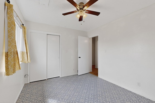 2110 Twisted Juniper Rd SE, Rio Rancho, NM 87124 - unfurnished bedroom with baseboards, a closet, and a ceiling fan