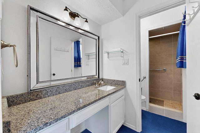 2110 Twisted Juniper Rd SE, Rio Rancho, NM 87124 - bathroom with toilet, vanity, and a tile shower