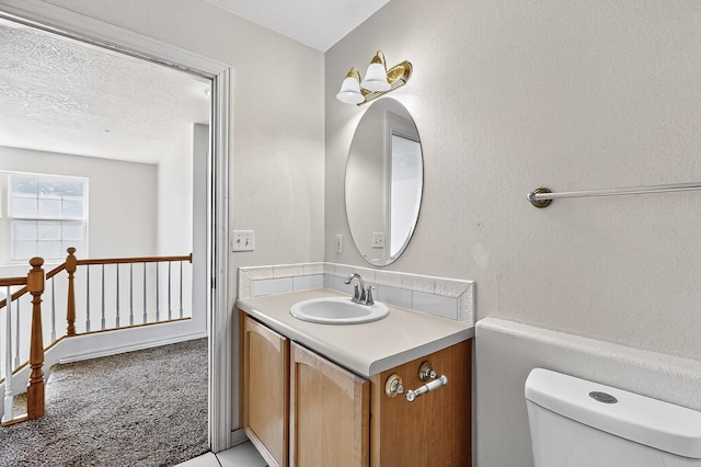 717 Monterrey Rd NE, Rio Rancho, NM 87144 - half bathroom with vanity and toilet
