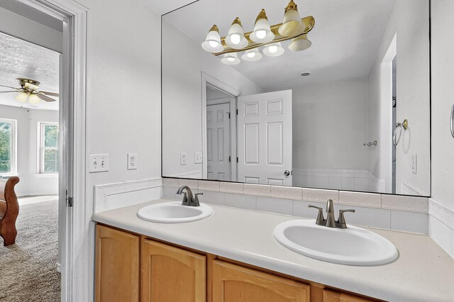 717 Monterrey Rd NE, Rio Rancho, NM 87144 - bathroom with double vanity and ceiling fan