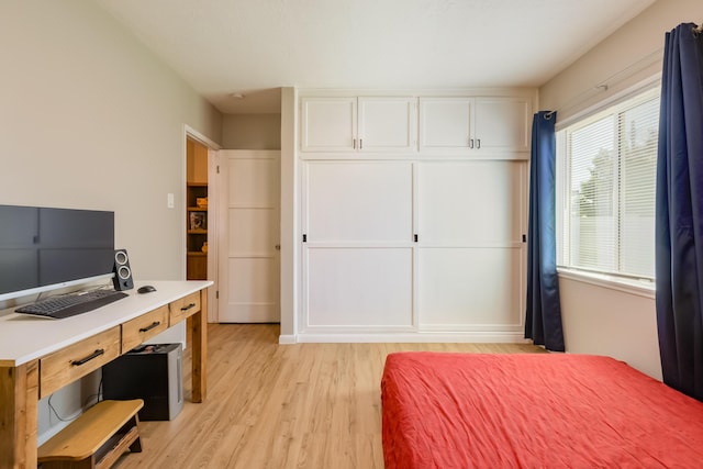 1805 California St NE, Albuquerque, NM 87110 - bedroom featuring light wood-style flooring and a desk