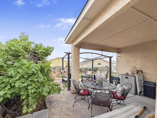 4532 Ambrose Alday Loop SE, Rio Rancho, NM 87124 - fenced backyard with outdoor dining space and a patio area