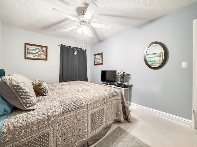 4532 Ambrose Alday Loop SE, Rio Rancho, NM 87124 - carpeted bedroom featuring a textured ceiling, ceiling fan, and baseboards
