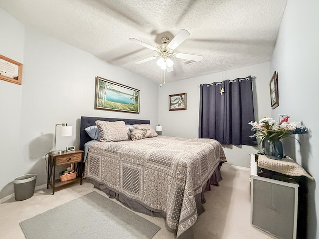 4532 Ambrose Alday Loop SE, Rio Rancho, NM 87124 - bedroom with light carpet, a textured ceiling, a ceiling fan, and baseboards