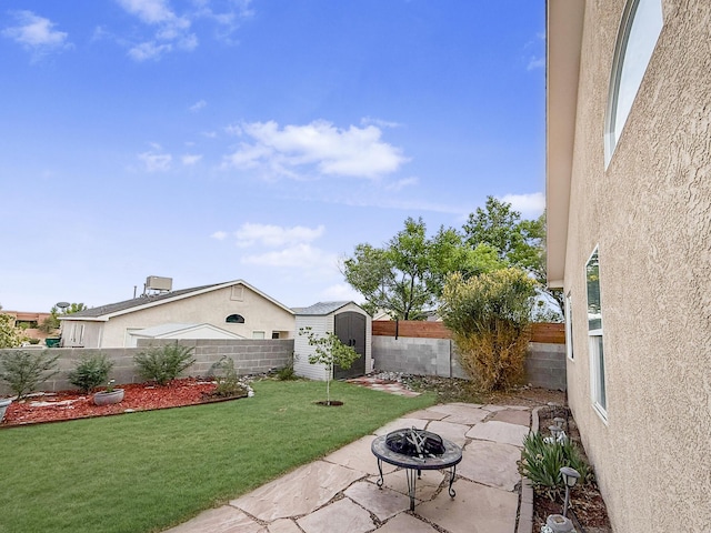 4532 Ambrose Alday Loop SE, Rio Rancho, NM 87124 - view of yard featuring a patio area and an outdoor fire pit