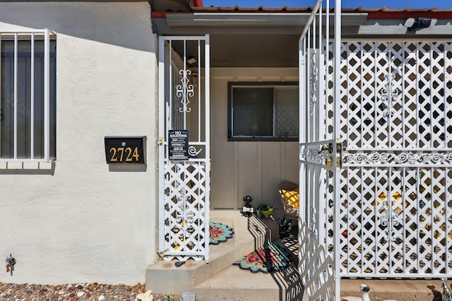 2724 Pennsylvania St NE, Albuquerque, NM 87110 - view of exterior entry featuring stucco siding