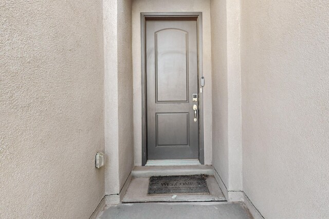 7037 Cleary Loop NE, Rio Rancho, NM 87144 - entrance to property featuring stucco siding