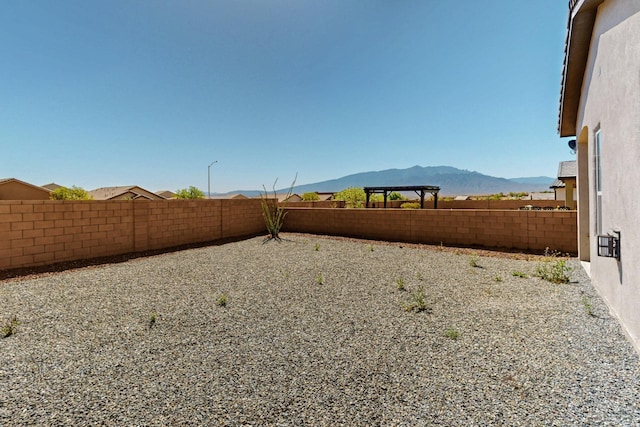 7037 Cleary Loop NE, Rio Rancho, NM 87144 - fenced backyard with a mountain view