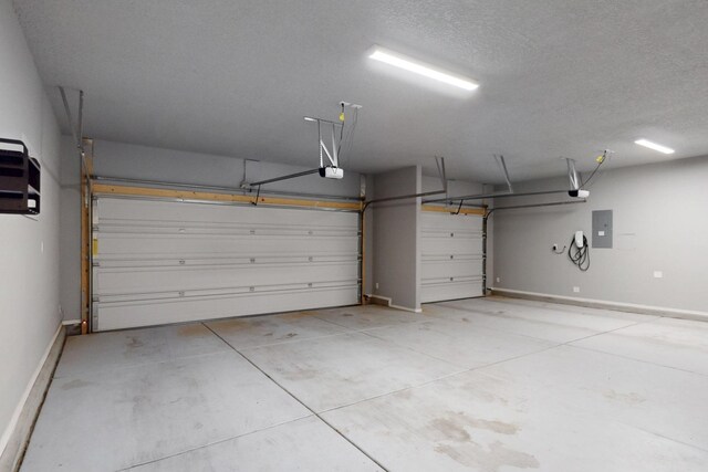 7037 Cleary Loop NE, Rio Rancho, NM 87144 - garage featuring electric panel, a garage door opener, and baseboards