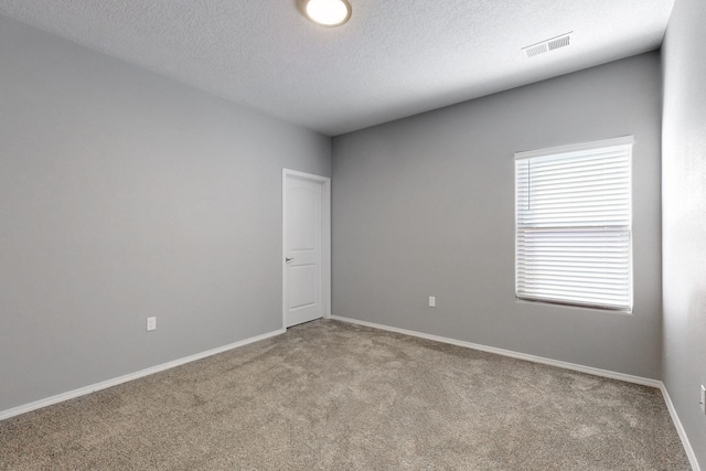 7037 Cleary Loop NE, Rio Rancho, NM 87144 - carpeted spare room with a textured ceiling and baseboards