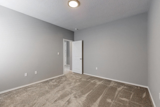 7037 Cleary Loop NE, Rio Rancho, NM 87144 - empty room featuring carpet flooring, a textured ceiling, and baseboards