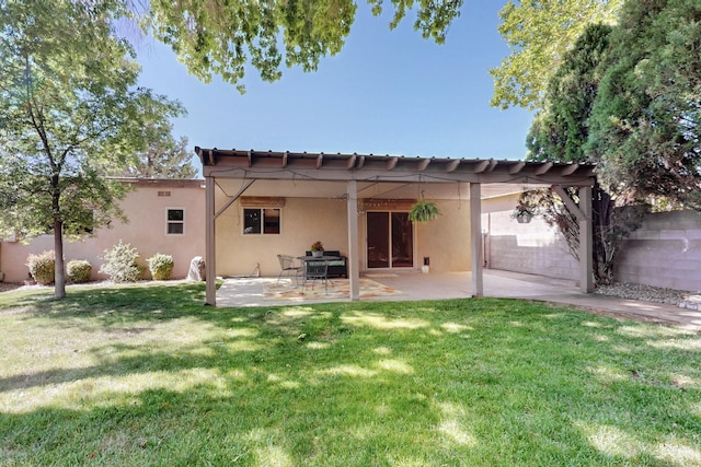 12304 Phoenix Ave NE, Albuquerque, NM 87112 - rear view of property with stucco siding, a yard, and a patio