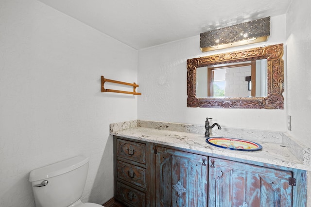 234 Horton Ln NW, Albuquerque, NM 87114 - half bathroom featuring toilet and vanity