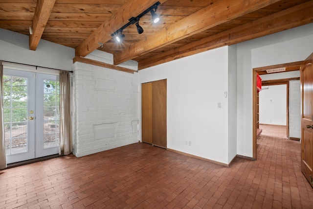 234 Horton Ln NW, Albuquerque, NM 87114 - empty room featuring brick flooring, wood ceiling with exposed beams, french doors, track lighting, and baseboards