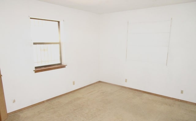 212 E Tingley Ave, Moriarty, NM 87035 - empty room with light colored carpet and baseboards