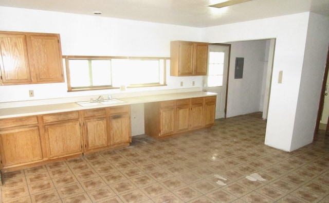 212 E Tingley Ave, Moriarty, NM 87035 - kitchen with light countertops and electric panel