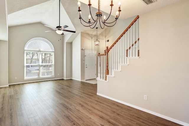 6923 Luz Del Sol Pl NW, Albuquerque, NM 87114 - foyer with a chandelier, ceiling fan, wood finished floors, stairs, and lofted ceiling