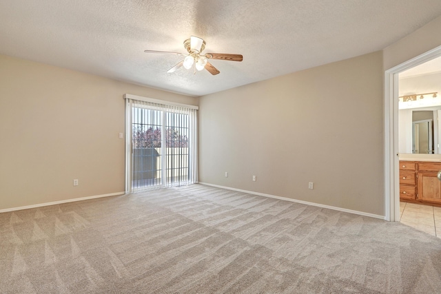6923 Luz Del Sol Pl NW, Albuquerque, NM 87114 - spare room with ceiling fan, light colored carpet, a textured ceiling, and baseboards