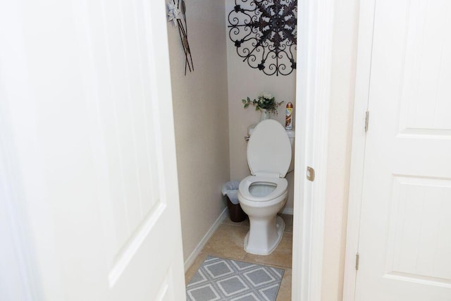 1019 Jacobs Dr NE, Rio Rancho, NM 87144 - bathroom featuring toilet, tile patterned flooring, and baseboards