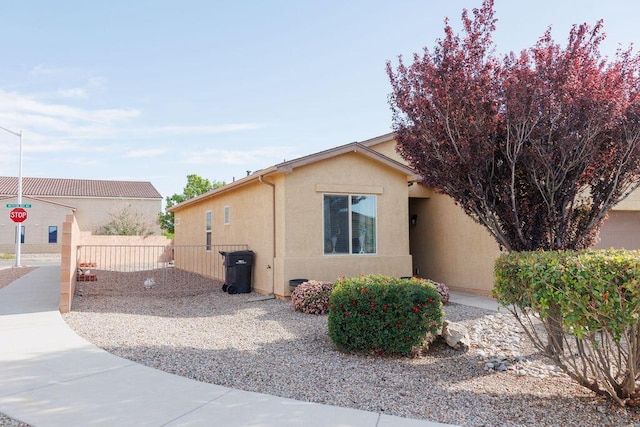 1019 Jacobs Dr NE, Rio Rancho, NM 87144 - view of side of home with stucco siding