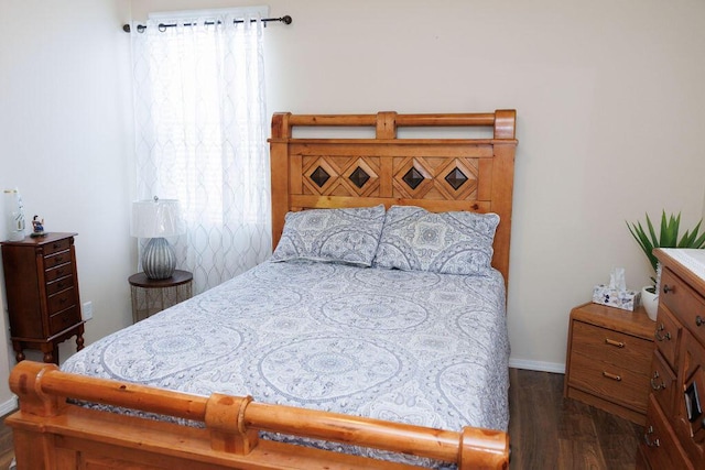 1019 Jacobs Dr NE, Rio Rancho, NM 87144 - bedroom featuring dark wood-style floors and baseboards