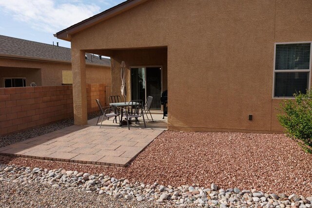 1019 Jacobs Dr NE, Rio Rancho, NM 87144 - back of property featuring a patio area and stucco siding