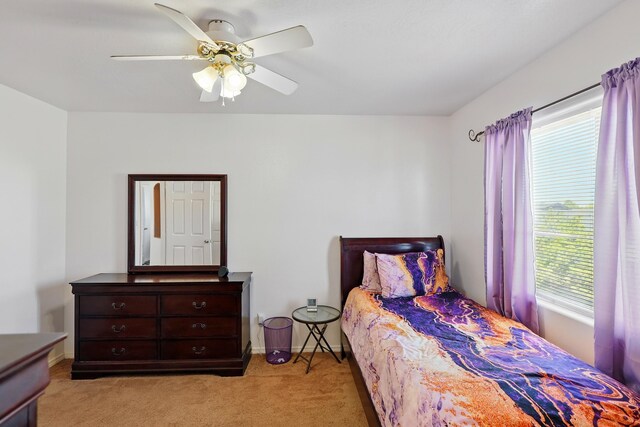 117 El Mundo Rd, Rio Communities, NM 87002 - bedroom featuring light colored carpet, a ceiling fan, and baseboards