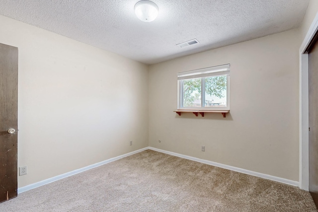 508 San Juan De Rio Dr SE, Rio Rancho, NM 87124 - unfurnished bedroom with carpet flooring, a textured ceiling, baseboards, and a closet