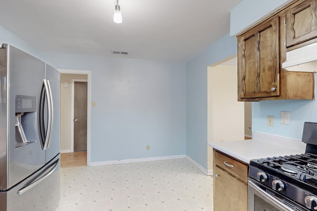 508 San Juan De Rio Dr SE, Rio Rancho, NM 87124 - kitchen with stainless steel appliances, light floors, light countertops, baseboards, and under cabinet range hood