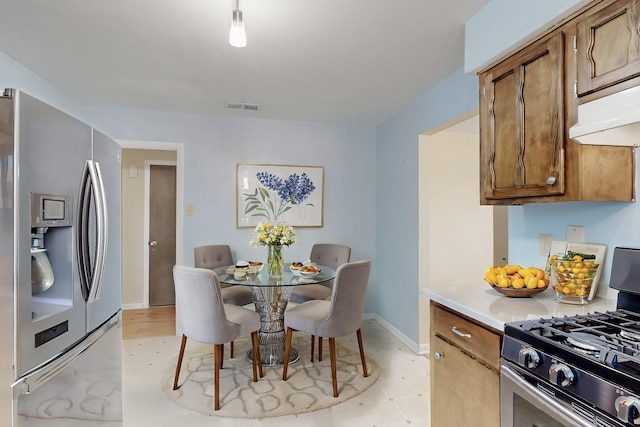 508 San Juan De Rio Dr SE, Rio Rancho, NM 87124 - dining space featuring baseboards and light floors