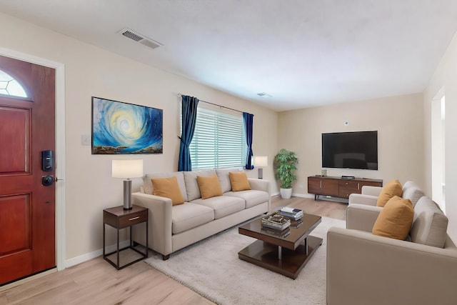 508 San Juan De Rio Dr SE, Rio Rancho, NM 87124 - living room featuring light wood-type flooring, healthy amount of natural light, and baseboards