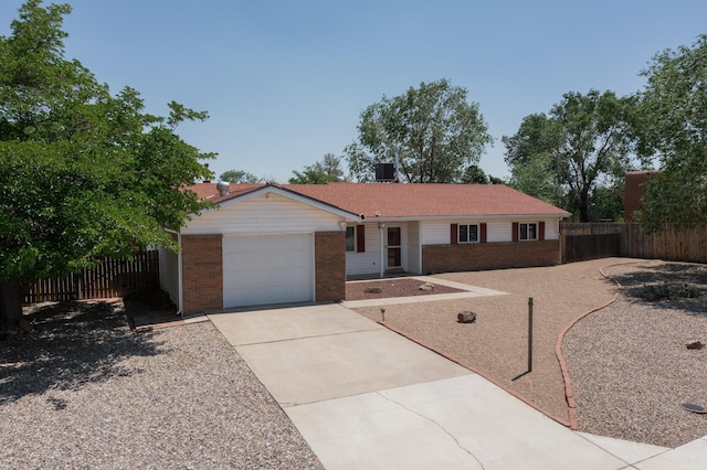 508 San Juan De Rio Dr SE, Rio Rancho, NM 87124 - ranch-style home featuring brick siding, driveway, and an attached garage