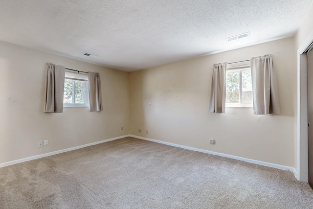 508 San Juan De Rio Dr SE, Rio Rancho, NM 87124 - carpeted spare room with a textured ceiling and baseboards