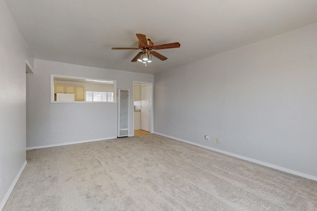 9913 Leyendecker Rd NE, Albuquerque, NM 87112 - empty room featuring a heating unit, ceiling fan, light carpet, and baseboards