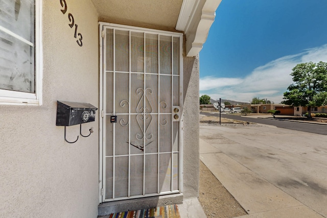 9913 Leyendecker Rd NE, Albuquerque, NM 87112 - entrance to property with stucco siding