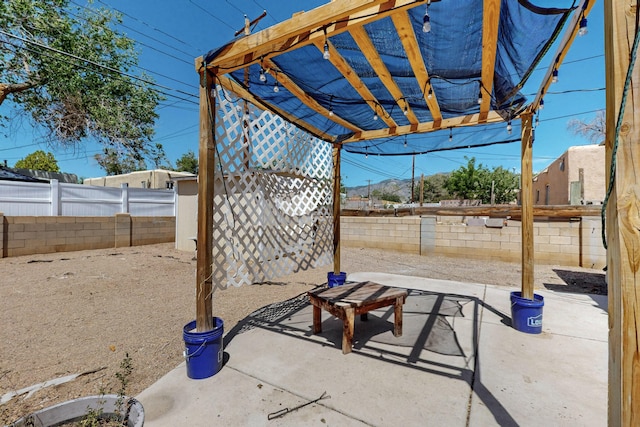 9913 Leyendecker Rd NE, Albuquerque, NM 87112 - fenced backyard with a pergola and a patio area
