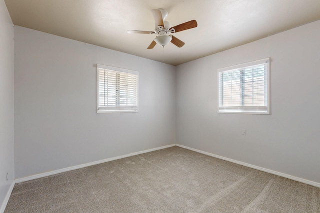 9913 Leyendecker Rd NE, Albuquerque, NM 87112 - carpeted spare room featuring plenty of natural light, baseboards, and ceiling fan